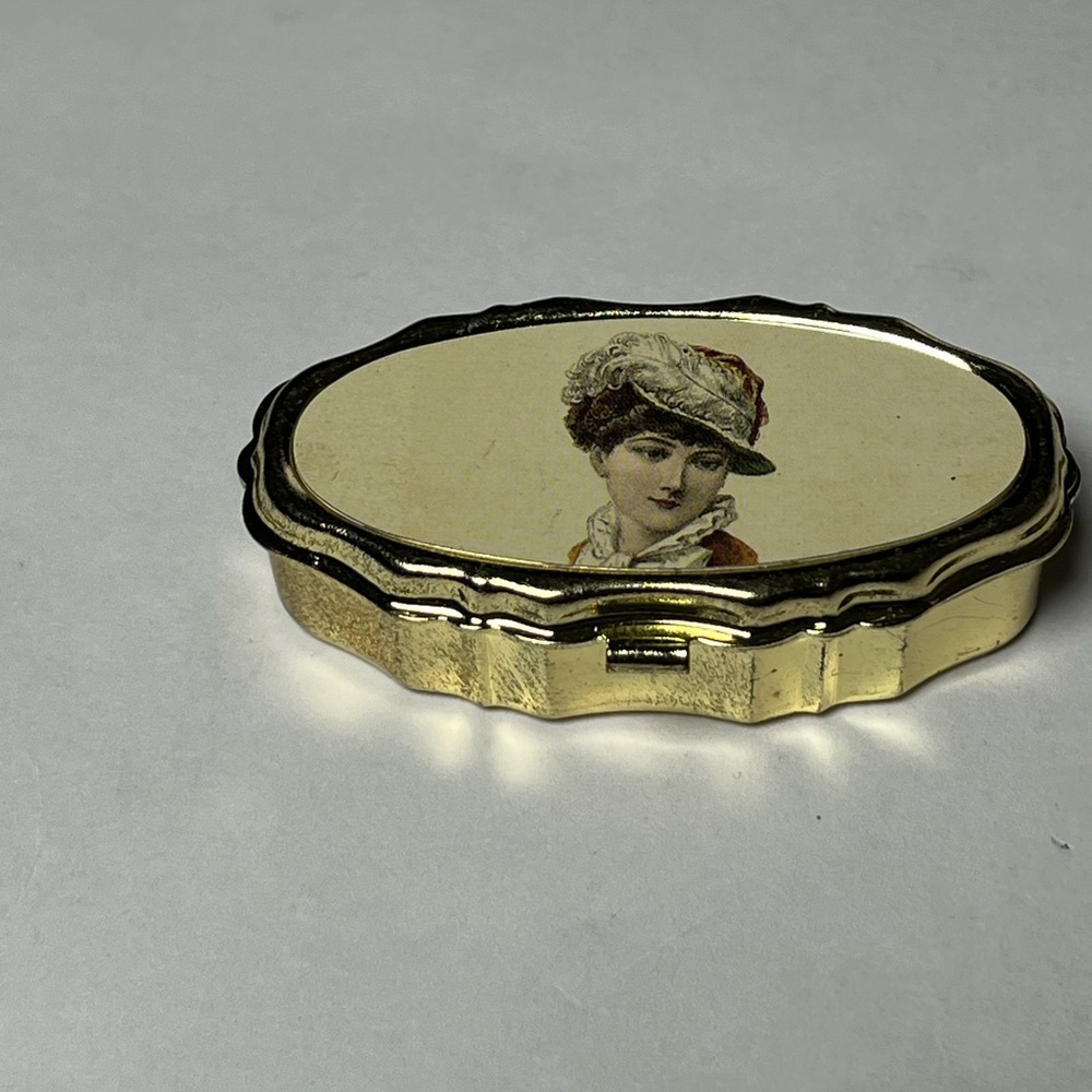NWOT 2 small metal sewing kits. Woman with hat on top of kit. Perfect for gifts!